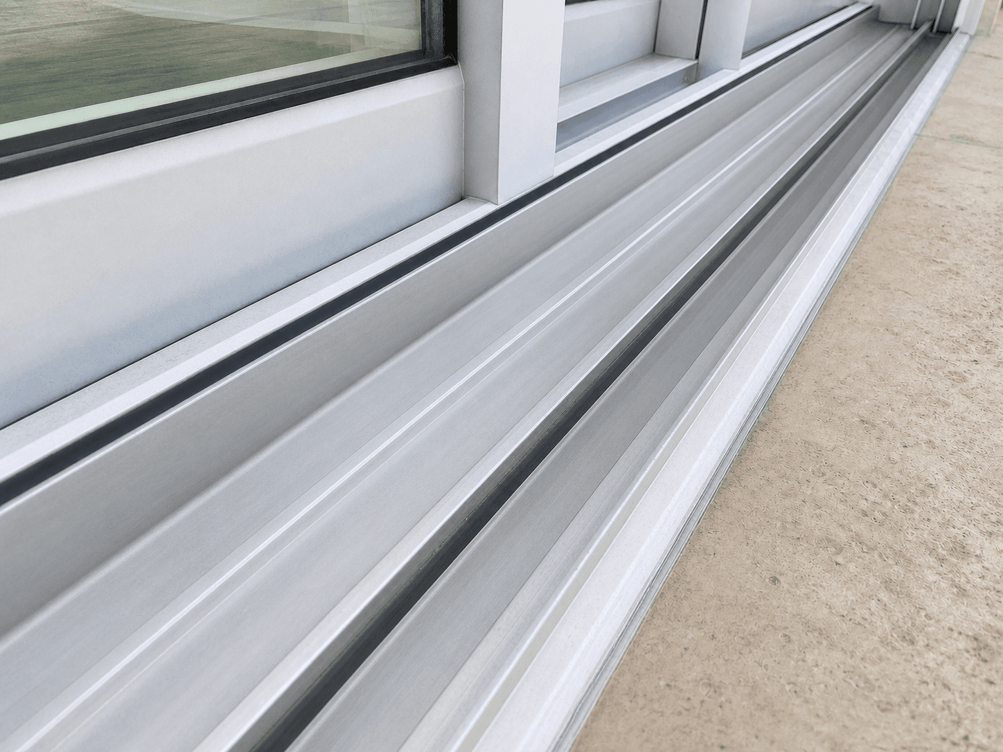 After track cleaning example showing a clean detailed sliding door track at a South Florida property