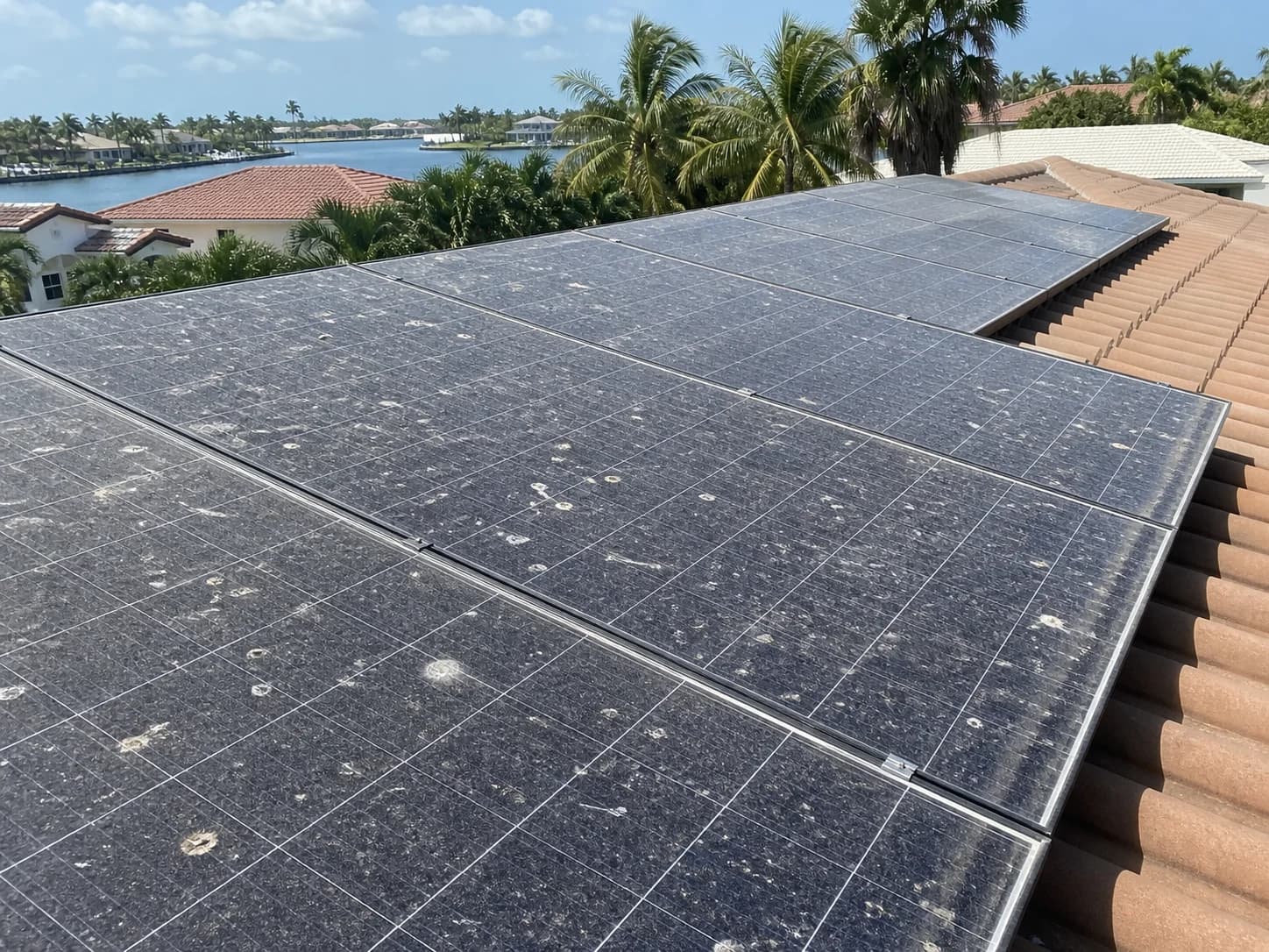 Before solar panel cleaning showing dusty panels with salt film on a South Florida home